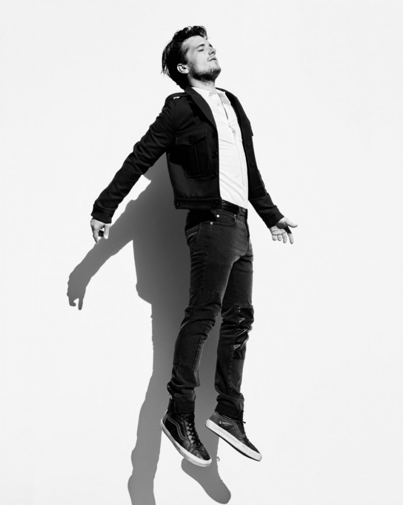 Josh Hutcherson wears jeans McQ by Alexander McQueen, shoes Vans, shirt and military style jacket Saint Laurent by Hedi Slimane.