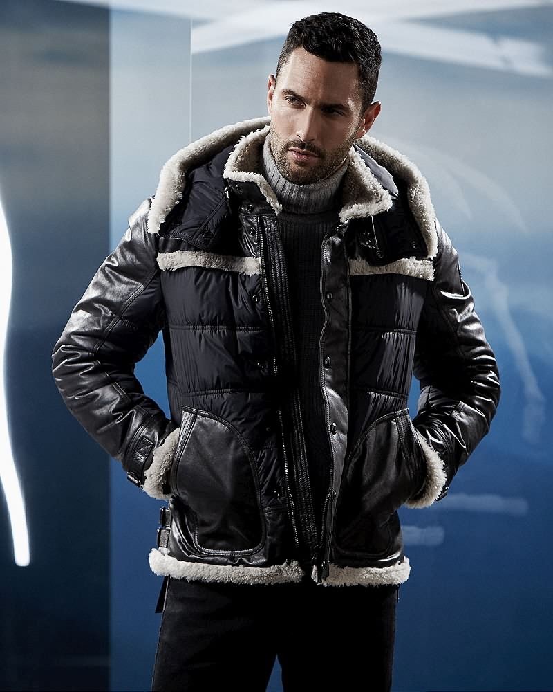 Noah Mills wears fur trimmed coat Belstaff