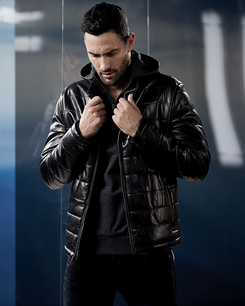 Noah Mills wears quilted leather jacket Andrew Marc.