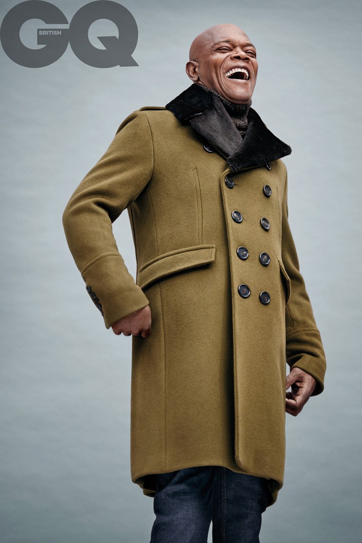 Enjoying a laugh, Samuel L. Jackson wears a coat from Burberry London.