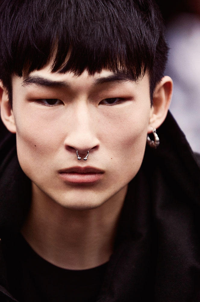 Armani Exchange model Sang Woo Kim delivers a close-up, showcasing his septum piercing.