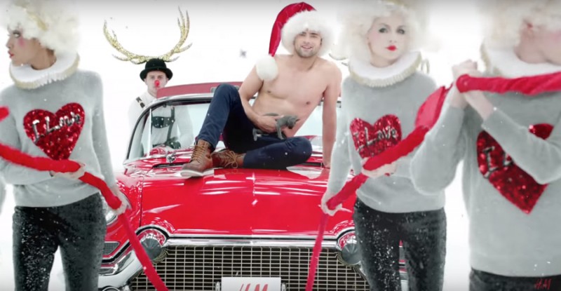 Wearing a Santa hat, Sean O'Pry appears in H&M's holiday 2015 campaign