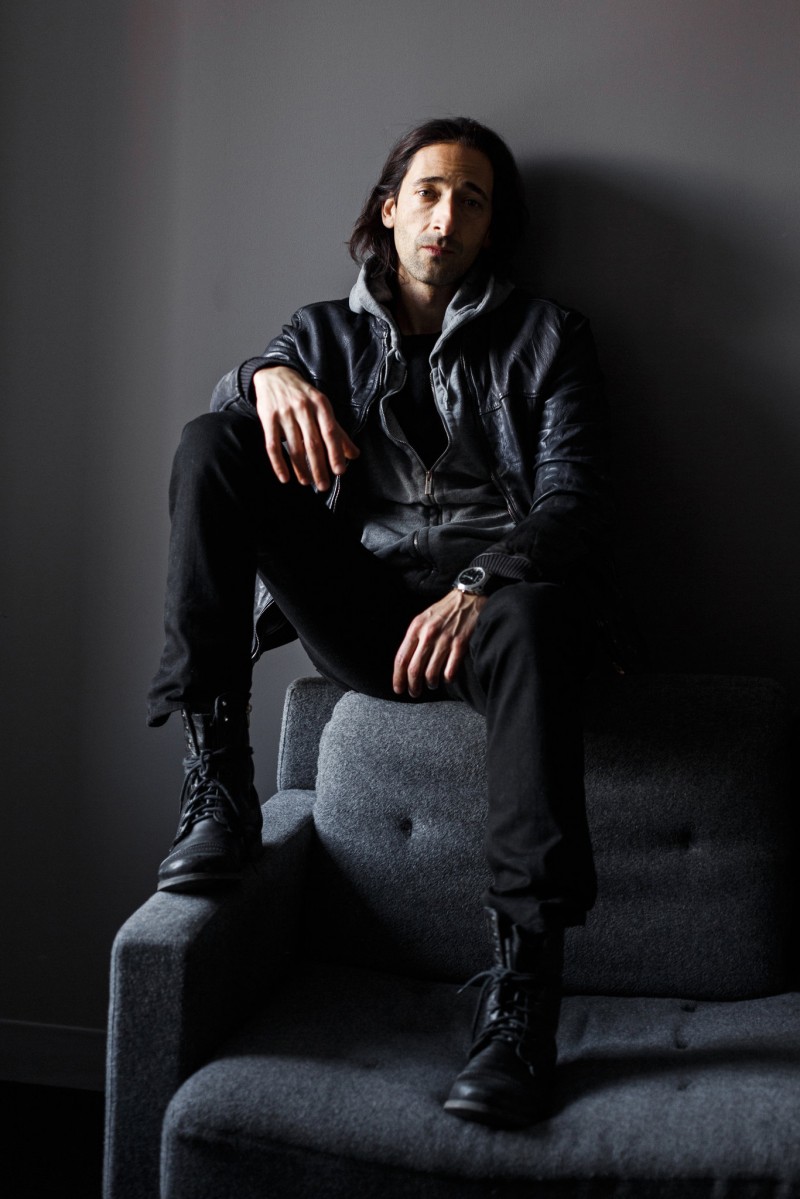 Adrien Brody photographed by Ike Edeani for The New York Times. Brody is pictured in his favorite boots–Steve Madden's Troopah boots.