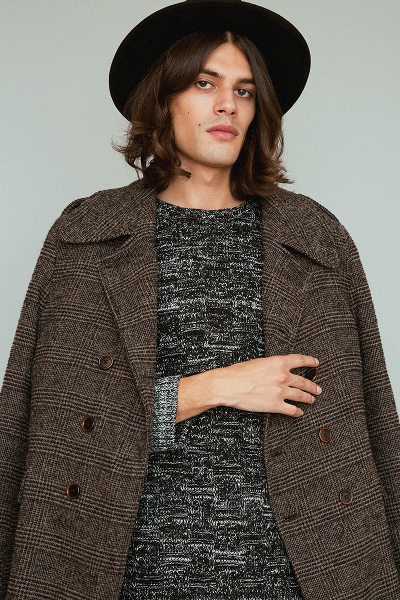 Álvaro wears coat Trussardi, sweater Religion and hat BKMTC.