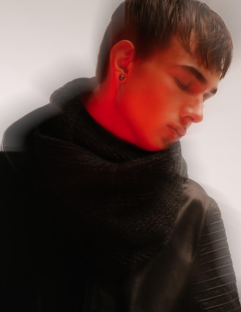 Marius wears Tahitian black pearl earrings Birks, scarf and leather bomber jacket A.P.C.