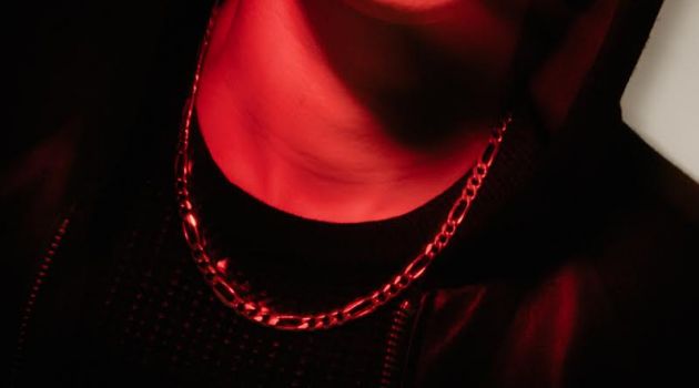 Charlatan: Marius by Mark Binks Marius wears leather jacket, sweater Zanerobe, Tahitian black pearl earrings and chain necklace Birks.
