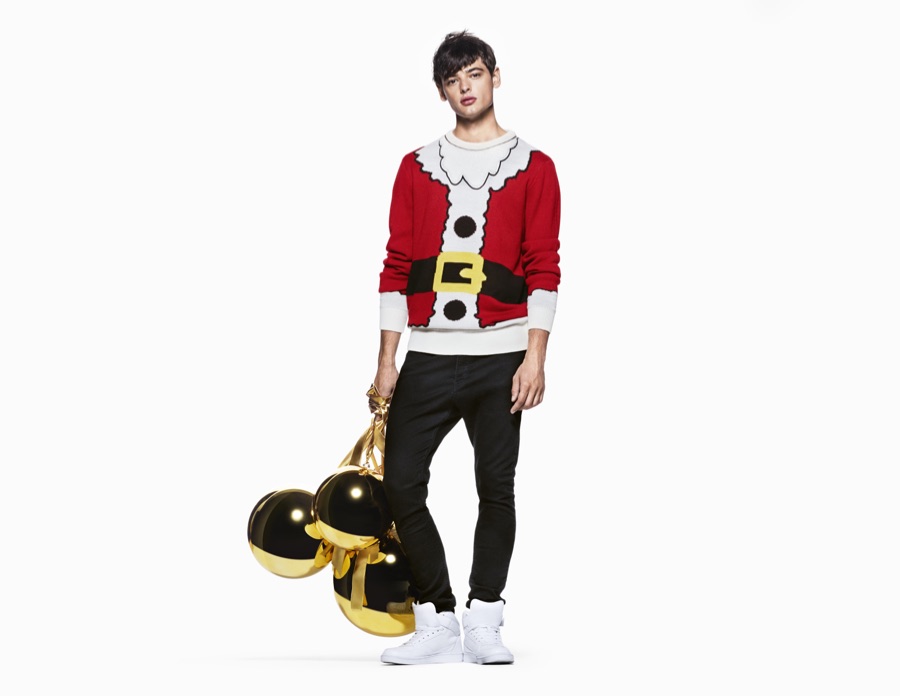 Wearing a Santa Claus top, Jacob Morton celebrates the holidays with H&M.