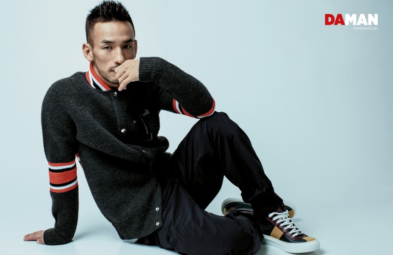 Hidetoshi Nakata dons a Givenchy knit with Jimmy Choo sneakers.