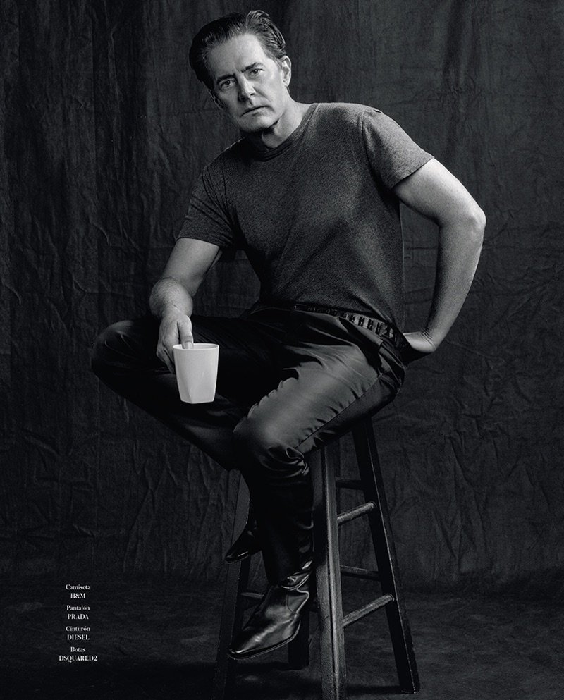 Kyle MacLachlan sits for a black & white studio portrait.