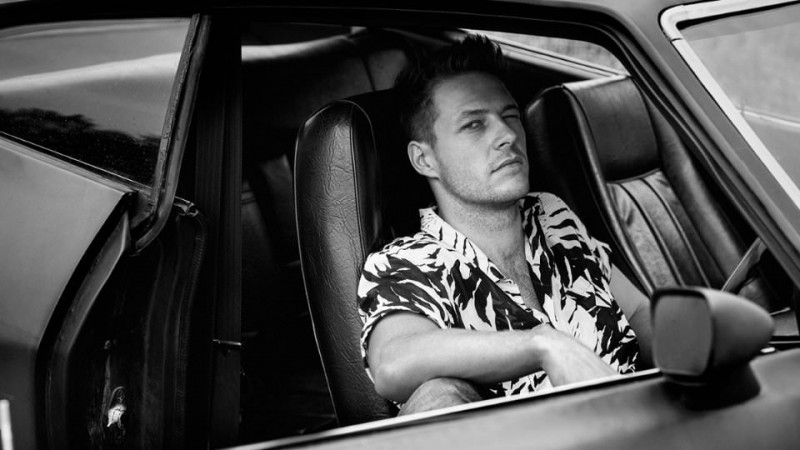 Luke Bracey wears a Saint Laurent Palm-Print Cotton Shirt for Mr Porter's The Journal photo shoot.