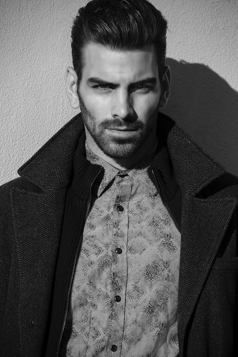 Nyle DiMarco wears shirt INC and coat Kenneth Cole.
