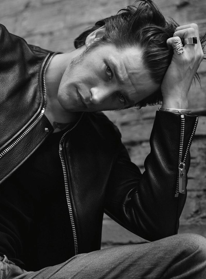 Vinnie Woolston poses for a black & white image from L'Express Styles.