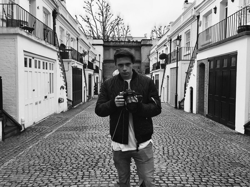 Brooklyn Beckham poses for a picture as Burberry's latest photographer.