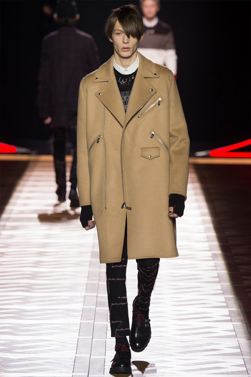 The camel coat is revisited for Dior Homme's fall-winter 2016 collection, borrowing details from the leather biker jacket.