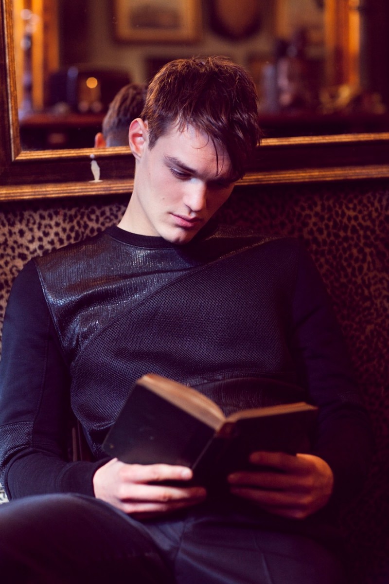 Christian wears sweater Helmut Lang and trousers Lanvin.