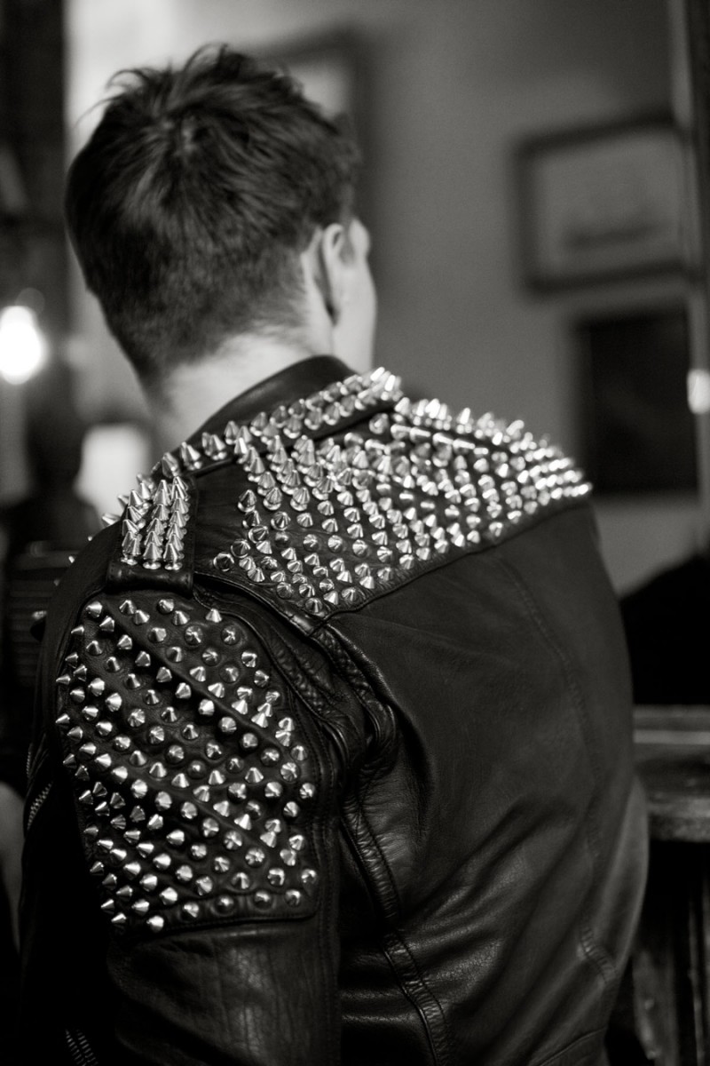 Christian wears leather biker jacket Burberry.
