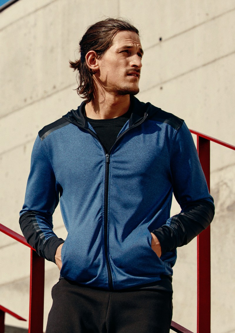 Jarrod Scott sports a running jacket from H&M.