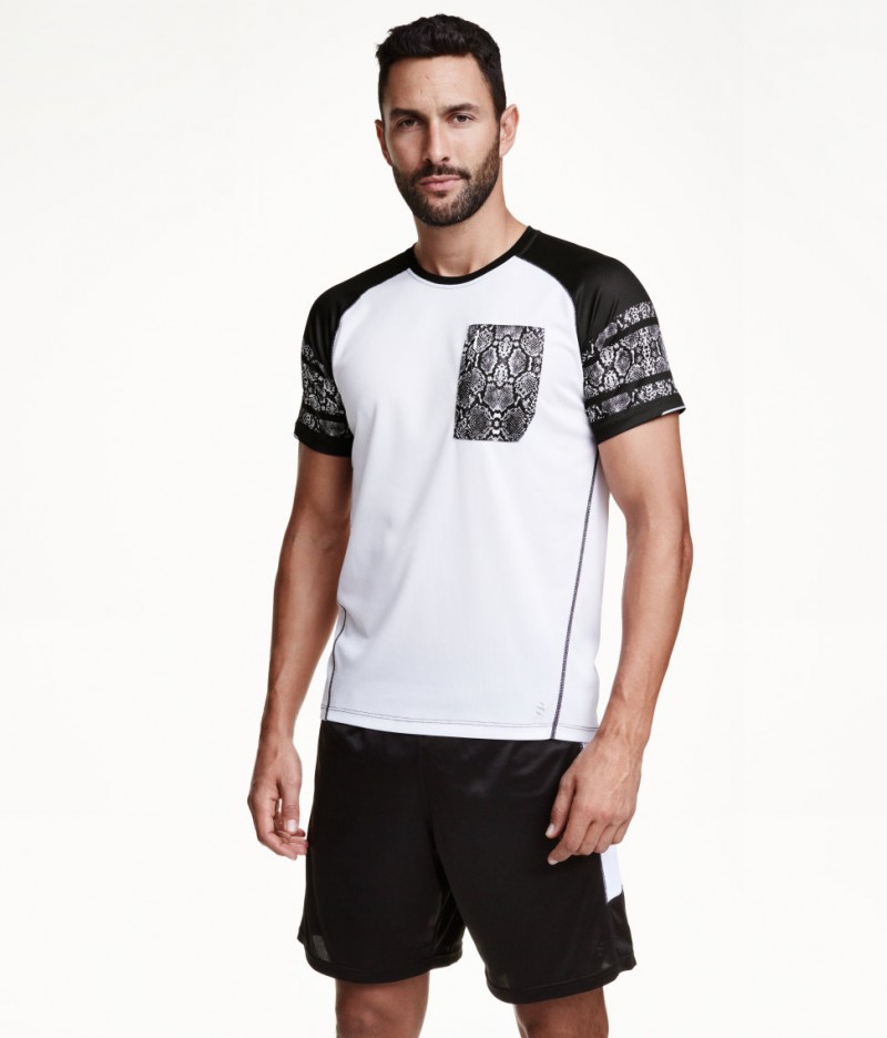 Noah Mills models H&M sports shorts.
