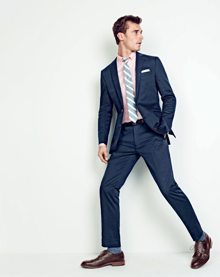 J.Crew men’s Ludlow suit jacket in Italian stretch chino, Ludlow cotton oxford shirt, Ludlow suit pant in Italian stretch chino, linen-cotton tie in textured stripe, sterling-silver bobby pin tie bar, English linen pocket square, medium-dot cotton socks and Ludlow wing tips. 