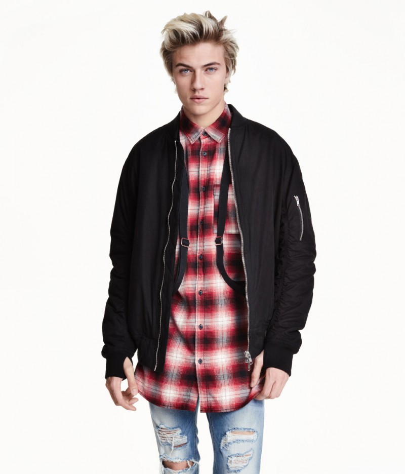 Lucky Blue Smith wears H&M Pilot Jacket with Suspenders. 