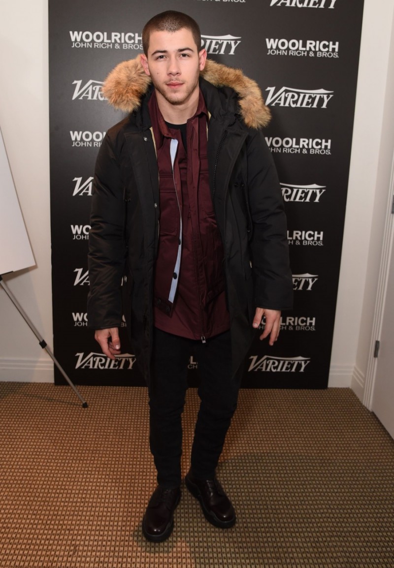 Nick Jonas poses for a photo in Woolrich John Rich & Bros. at the 2016 Sundance Film Festival.