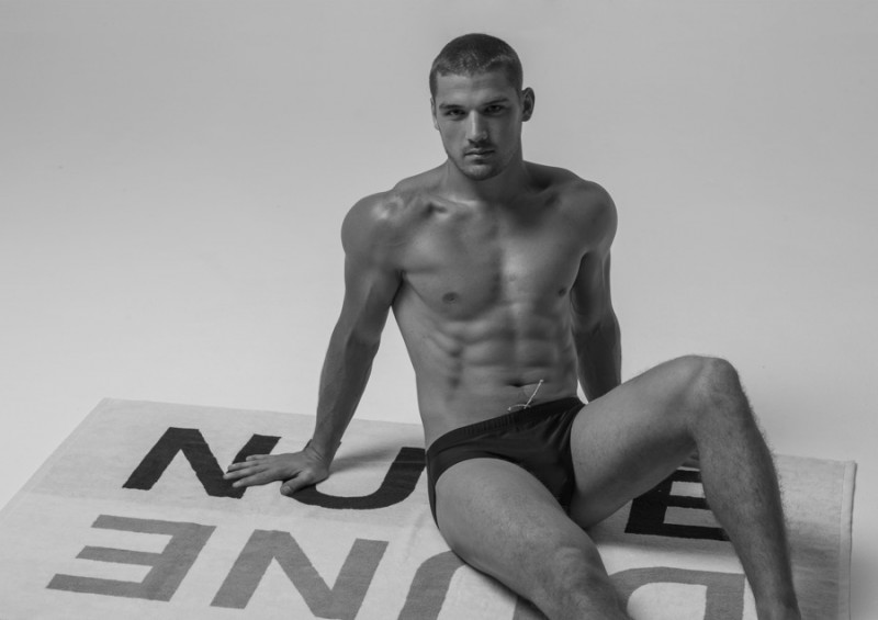 Kerry Degman is beach ready with one of Ron Dorff's towels and a black swimsuit.