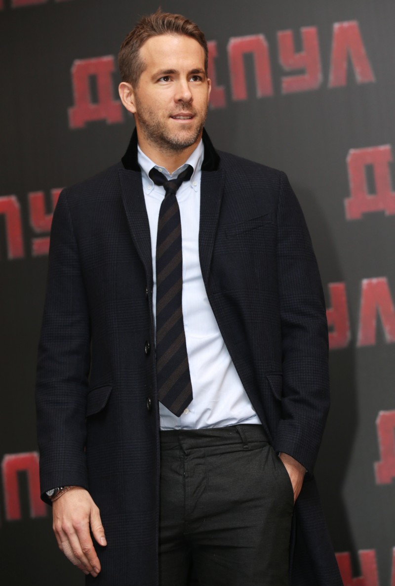 Attending a Deadpool press conference in Moscow, Russia, Ryan Reynolds embraced a smart look in tailored separates, a clean dress shirt and striped tie.