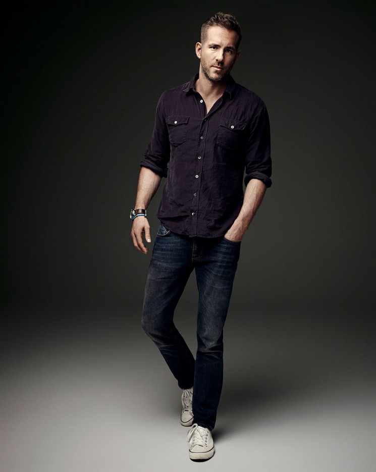 Photographed by Art Streiber for Empire magazine, Ryan Reynolds goes casual in a two-pocket shirt, distressed denim jeans and white sneakers.