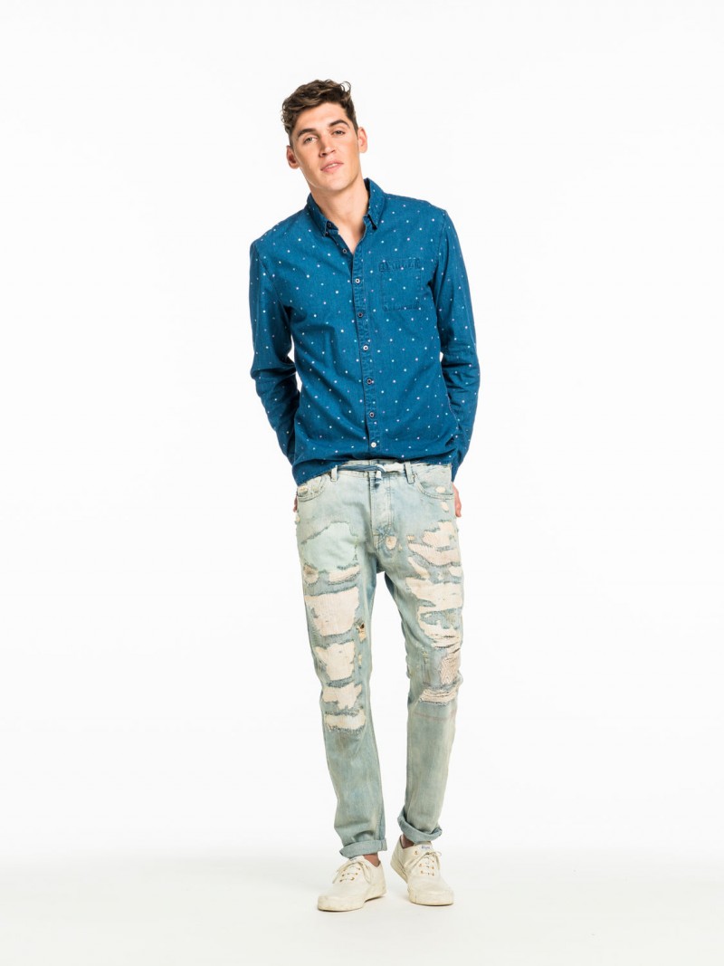 Model Isaac Carew wears Scotch & Soda Indigo Polka Dot Shirt