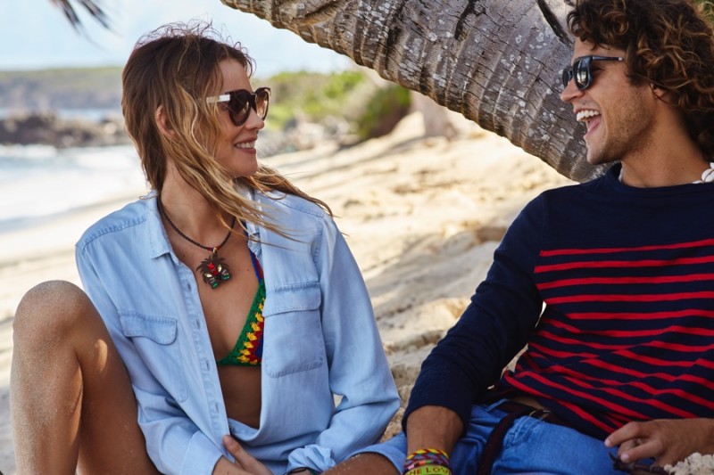 Models Behati Prinsloo and Miles McMillan are all smiles behind the scenes of Tommy Hilfiger's spring-summer 2016 campaign.