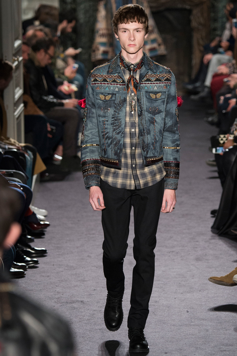Valentino revisits the denim jacket, adding its signature embellishments. 