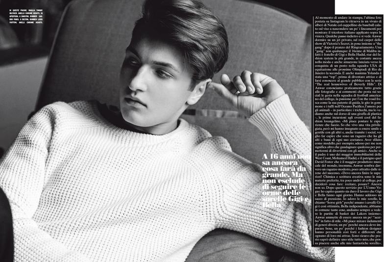Photographed for L'Uomo Vogue, Anwar Hadid models a neutral colored sweater from Tommy Hilfiger.