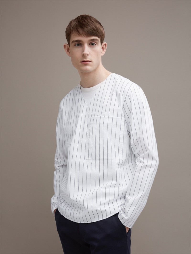 Karl Morrall wears COS' V-Neck Oversized Shirt.