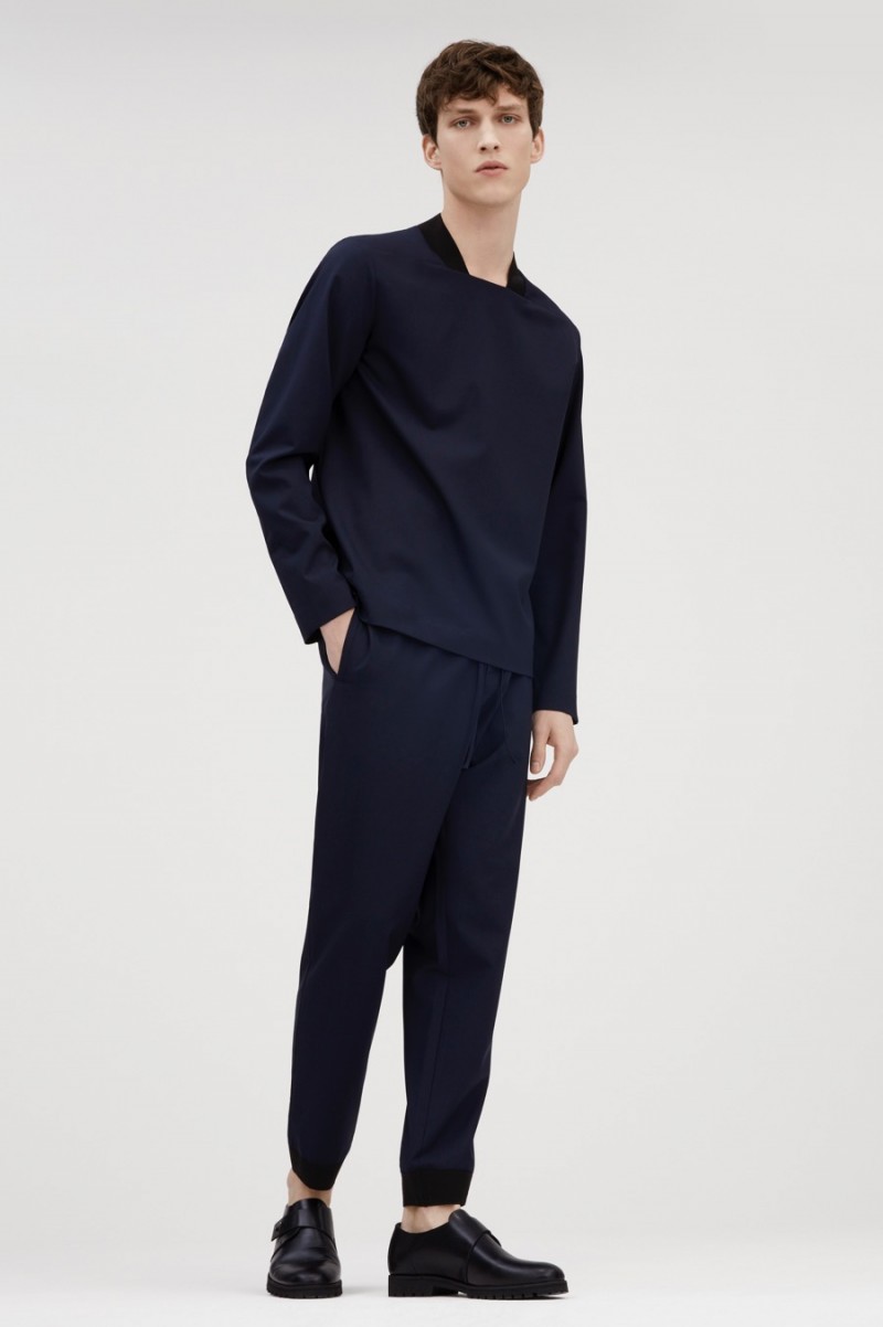 Malthe Lund Madsen wears a COS ribbed square-neck top with cuffed trousers and grip-sole monk strap shoes. » New Arrivals: COS Updates Everyday Essentials Malthe Lund Madsen wears a COS ribbed square-neck top with cuffed trousers and grip-sole monk strap shoes.