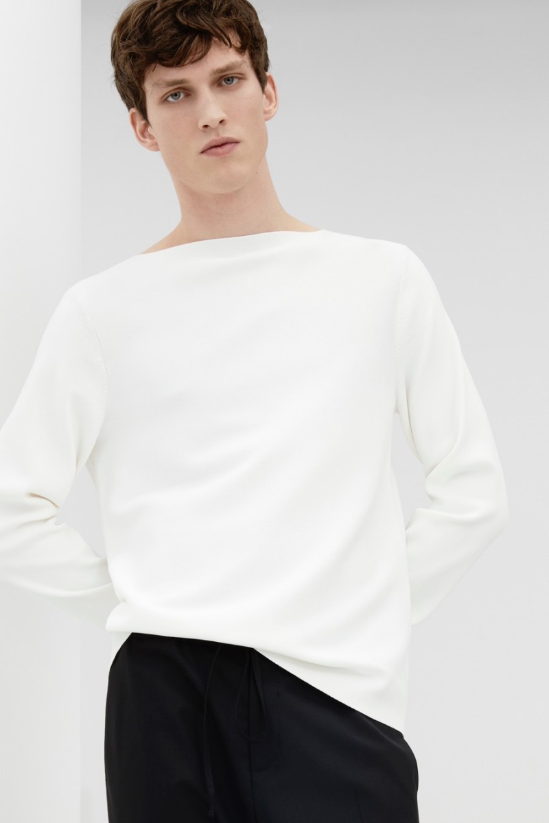Malthe Lund Madsen wears a COS slit-neck jumper with drawstring tailored trousers. » New Arrivals: COS Updates Everyday Essentials Malthe Lund Madsen wears a COS slit-neck jumper with drawstring tailored trousers.