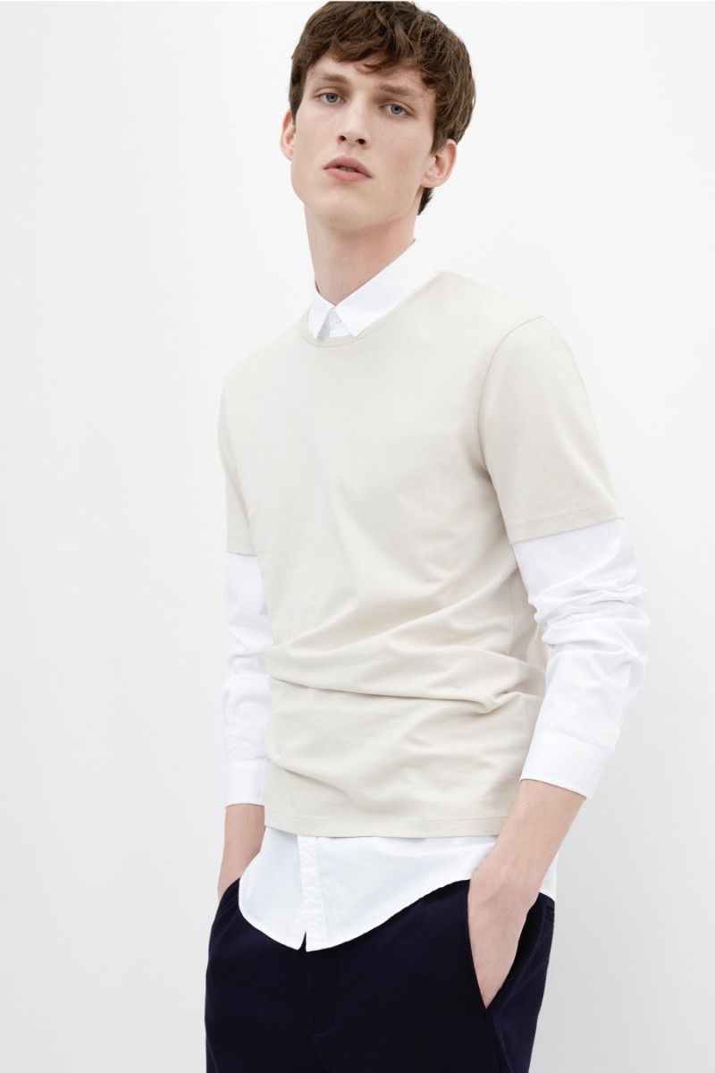 Malthe Lund Madsen wears a COS round neck t-shirt with a cotton twill shirt and elasticated cuff trousers.