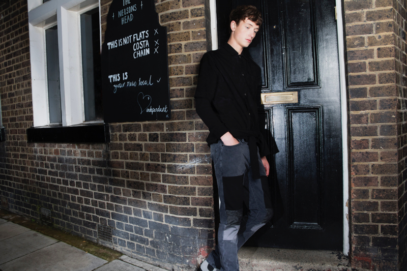 Jasper wears suede short-sleeve shirt Wood Wood, double t-shirt Christopher Shannon, black jeans with patches Natural Selection and boots Dr. Martens.