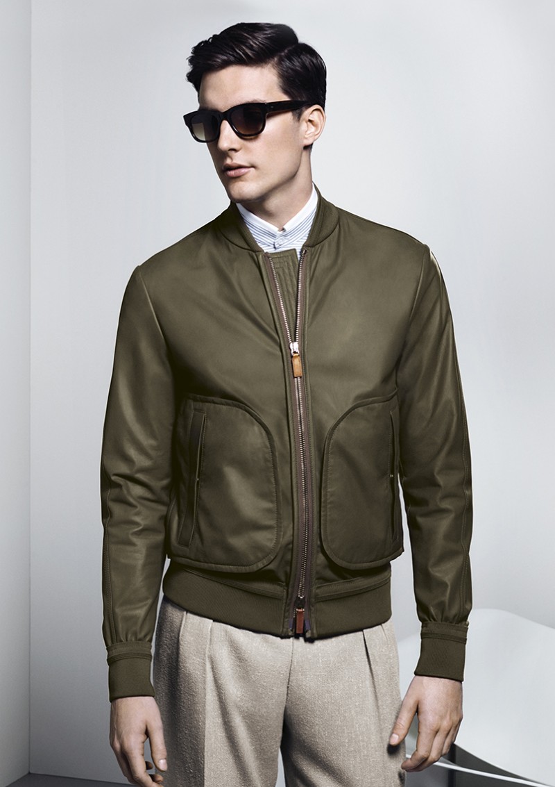 Model Charlie Timms photographed in an army green bomber jacket from Canali's spring-summer 2016 collection.