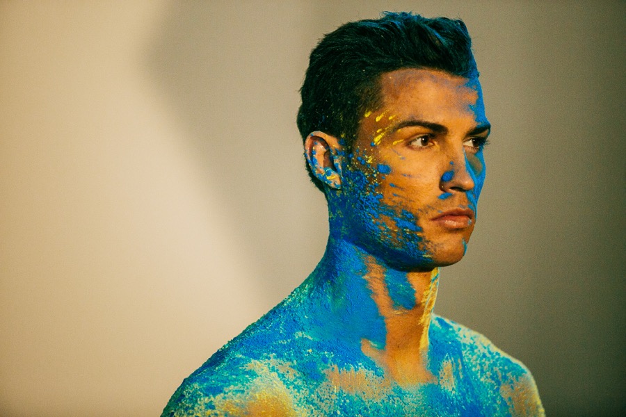 Cristiano Ronaldo dissolving into colorful liquid oil paint