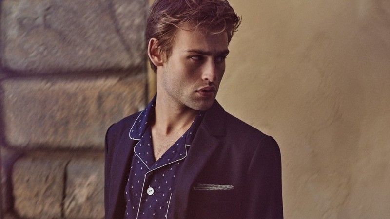 Douglas Booth wears navy slim-fit blazer Ami, pajama shirt Derek Rose and double-faced silk and cotton blend pocket square Brunello Cucinelli.