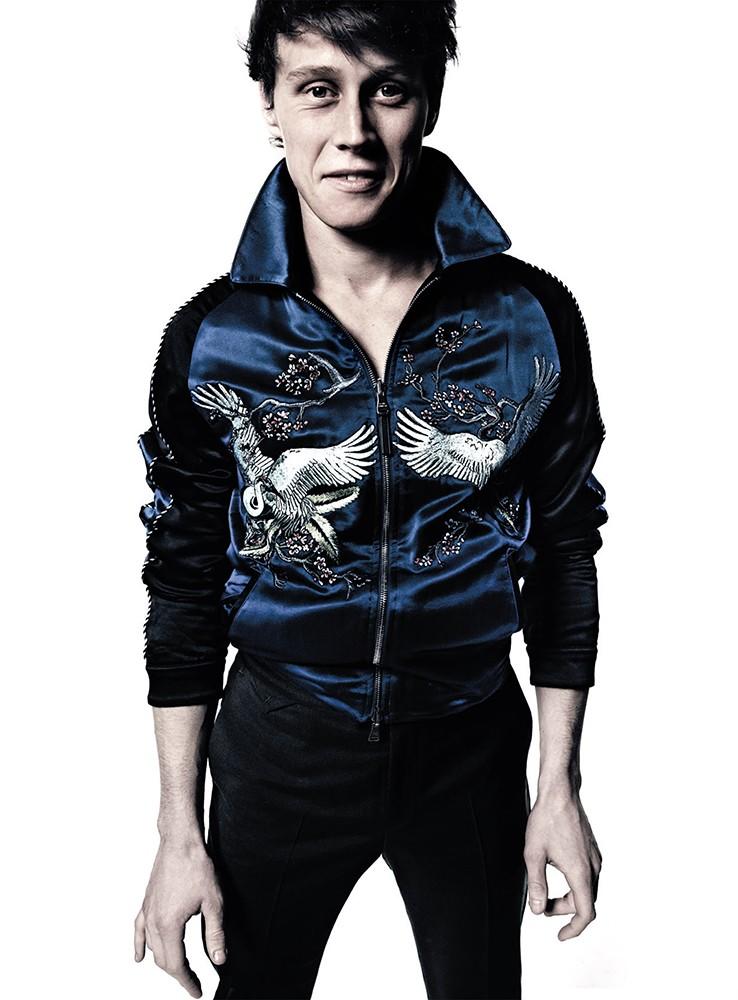 George Mackay sports one of Louis Vuitton's trendy silk bomber jackets for L'Uomo Vogue.