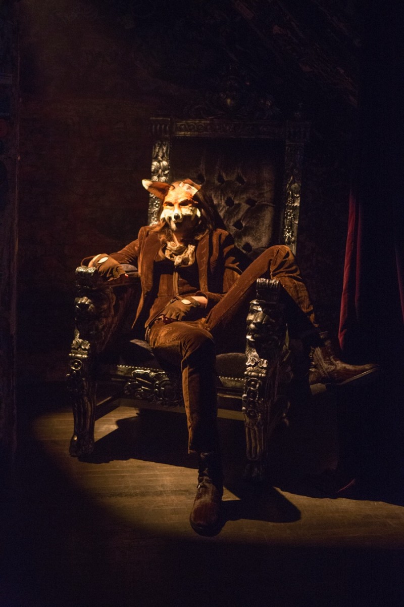 A model lounges in a dapper brown tailored number for John Varvatos' fall-winter 2016 presentation.