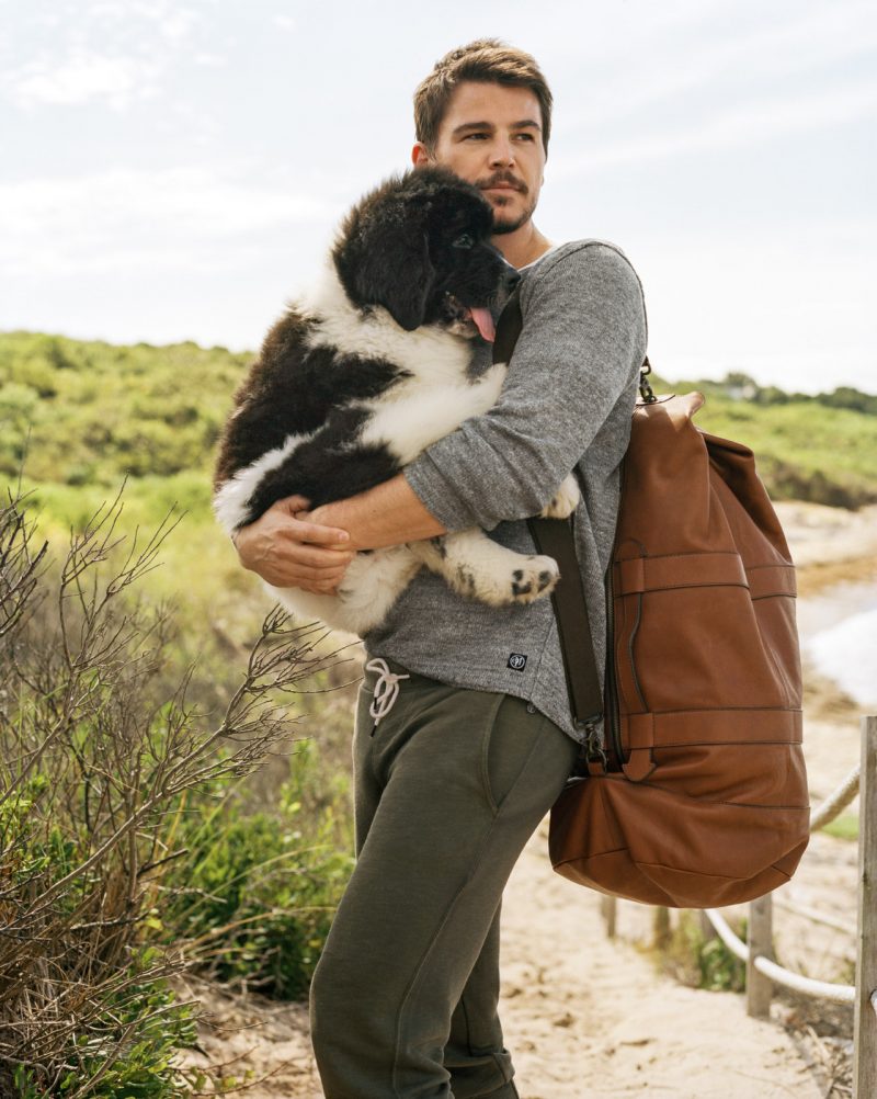 Photographed by Bruce Weber, Josh Hartnett poses with a dog for Marc O'Polo's spring-summer 2016 campaign.