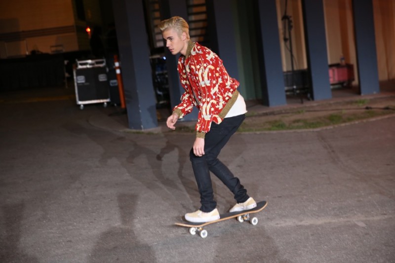 Justin Bieber skateboards outside Saint Laurent's fall-winter 2016 show.