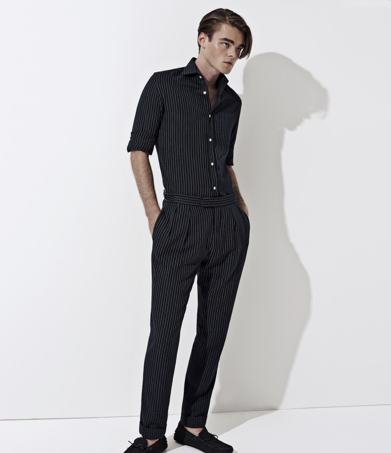 Konrad Annerud is a sleek figure in black menswear from Ralph Lauren Purple Label.