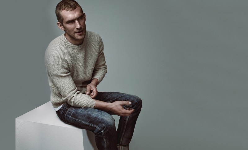 Will Chalker wears sweater Balenciaga, double-layer t-shirt Raey and mid-rise slim-cut jeans Mastercraft Union.