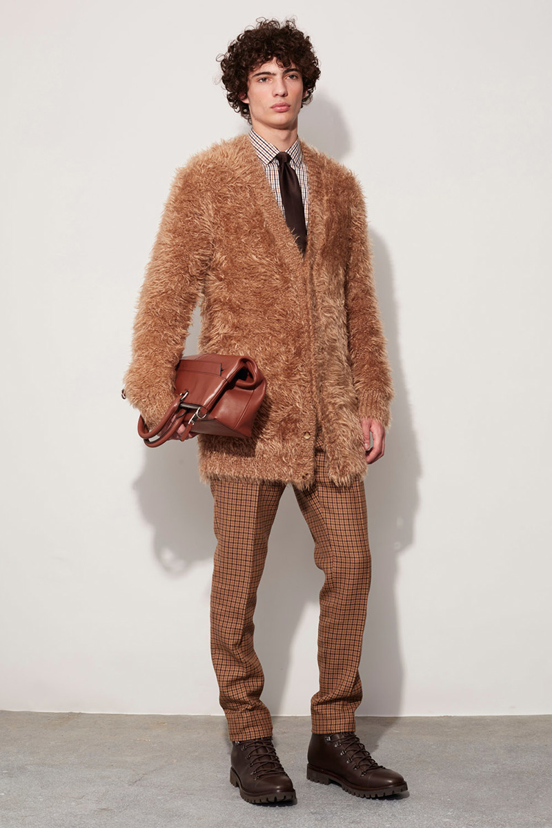 Michael Kors charms with its soft fuzzy sweater in a brilliant camel hue.