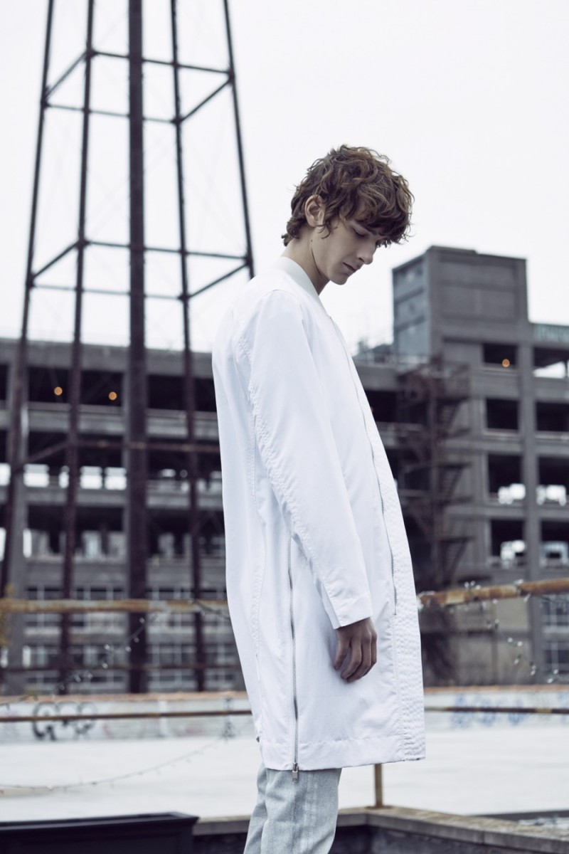 Dominik Hahn embraces a white coat from PLAC that's perfect for summer.
