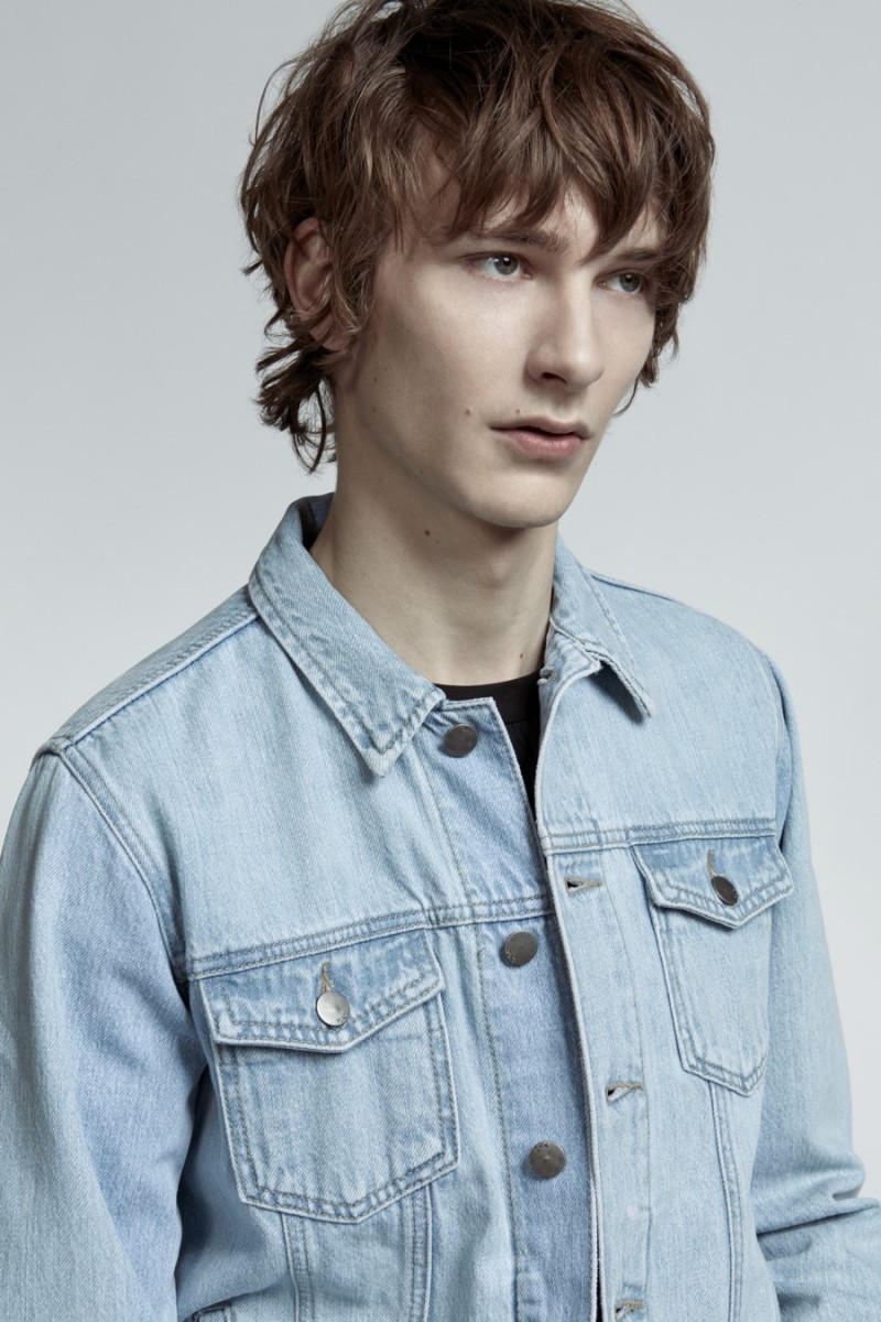 One of PLAC's founding basics, Dominik Hahn dons a denim jacket.