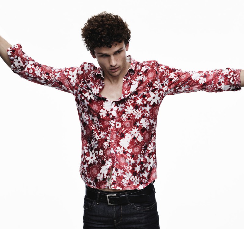 Simon Nessman wears a red floral print shirt for Pepe Jeans' spring-summer 2016 campaign.